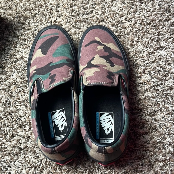 Vans and first pair are red and white and the other is black and green and brown - Picture 1 of 6